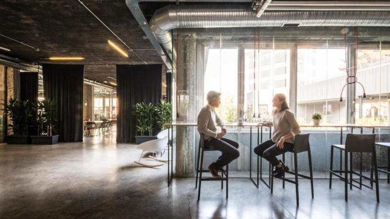 Photograph of two professionals collaborating at Talent Garden co-working space in Milan Italy